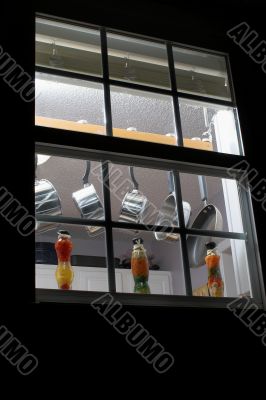 pots and pans in a kitchen window
