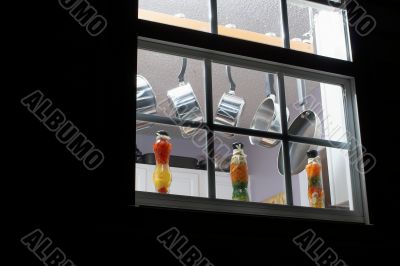 pots and pans in a kitchen window
