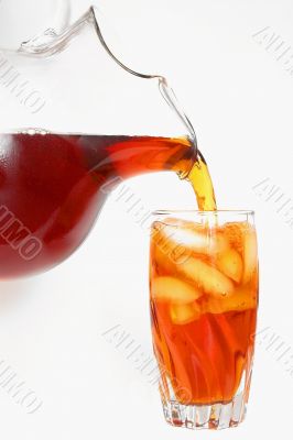 delicious iced tea pouring into a glass