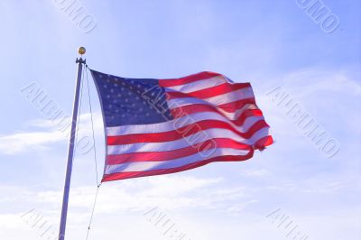 an American flag flying in the wind
