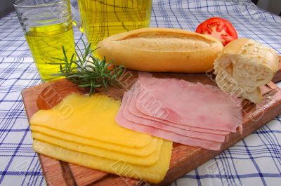 Snack with bread, cheese, ham and juice