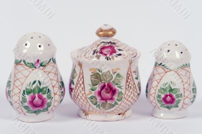 two saltshakers and  mustard-pot