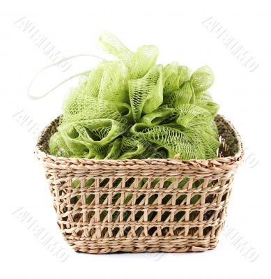 Green bath loofah in a basket