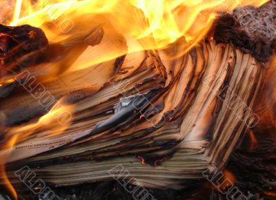 burning stack of paper sheets