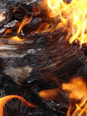 burning stack of paper sheets