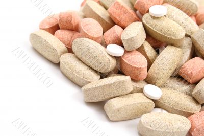pile of various pills isolated on white