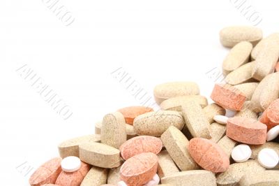 pile of various pills isolated on white