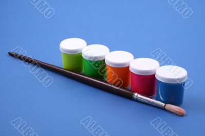 colorful paints close-ups blue background
