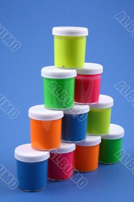 colorful paints close-ups blue background