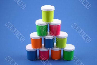 colorful paints close-ups blue background