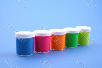 colorful paints close-ups blue background