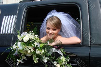 Happy Bride in limousine window