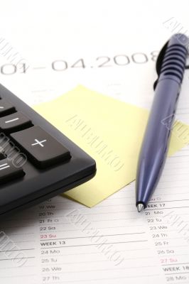 year planner with pen and calcularor
