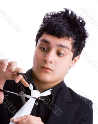 Young man cutting his tie