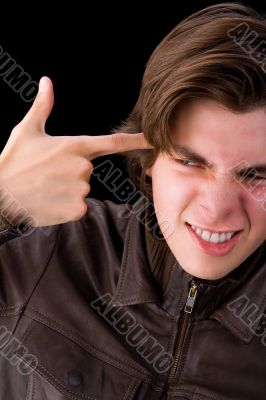 Boy with finger on face
