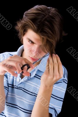 Boy cutting his hair