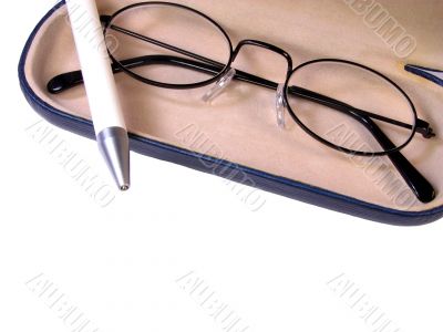 Glasses and ballpen
