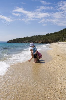 Ma with child on beach