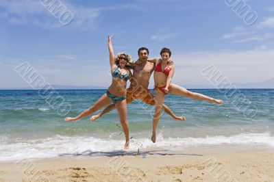 Young men jump on seacoast