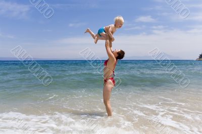 Ma with child on beach