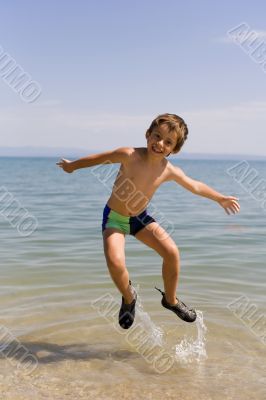 Child jump on seacoast