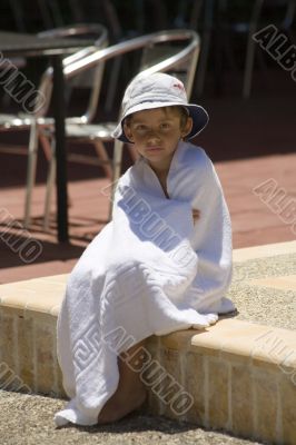 portrait of the boy beside swimming pool