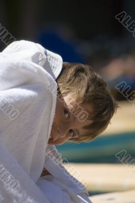 portrait of the boy beside swimming pool