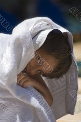portrait of the boy beside swimming pool