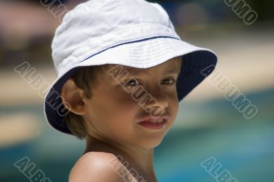 portrait of the boy beside swimming pool