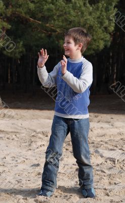 Boy playing with opened hands