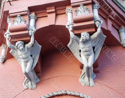 Architecture demons on wall of house in Kiev