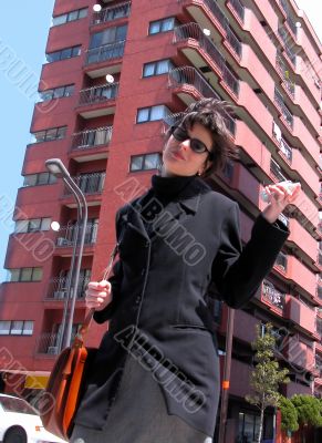 Woman With Phone In A City