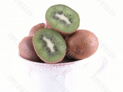 fresh, green kiwi in big cup