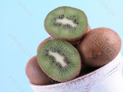 fresh, green kiwi in big cup