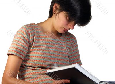 Girl looking in a notebook