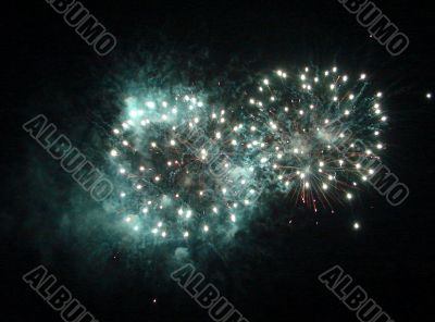 Night celebration fireworks upon dark sky