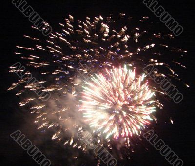 Night celebration fireworks upon dark sky