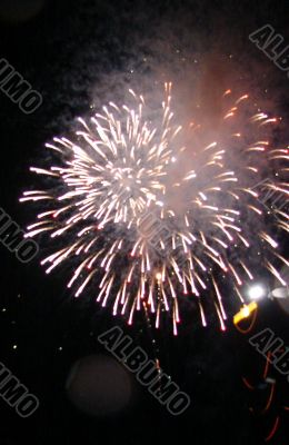 Night celebration fireworks upon dark sky