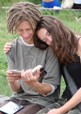 Young stydents reading in street