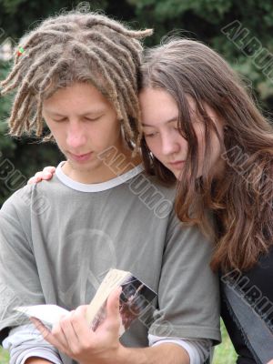 Young stydents reading in street