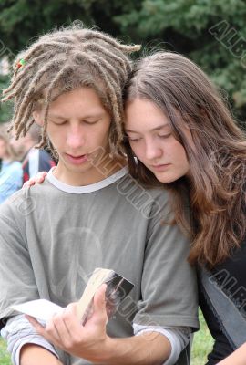 Young stydents reading in street