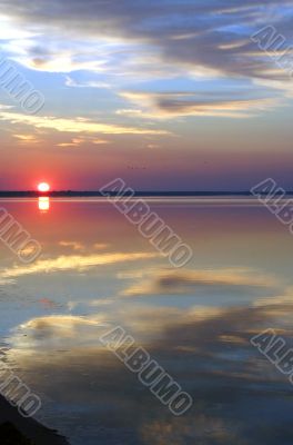 The sun, clouds and water