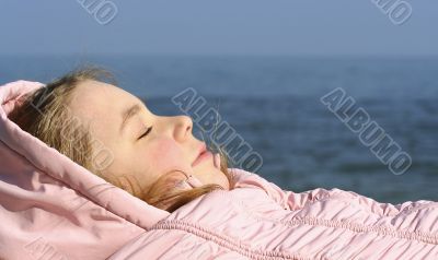 The girl has a rest near the sea