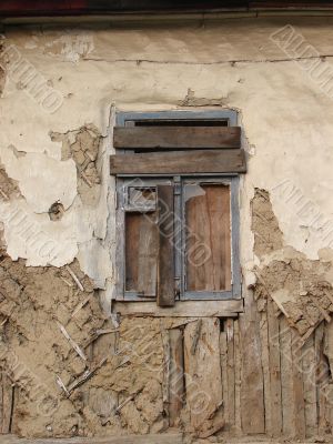 Alone window of aged ruined urban building