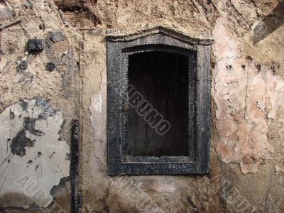 Alone window of aged ruined urban building