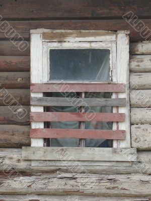 Alone window of aged ruined urban building