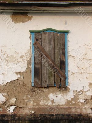 Alone window of aged ruined urban building
