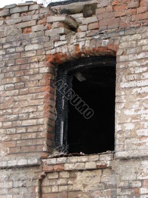 Alone window of aged ruined urban building