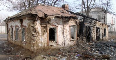 Burned abandoned wintage town building