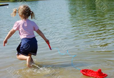 Child with toy-ship